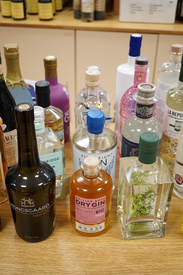 A large collection of various spirits and liqueurs, mostly gin, twenty six bottles